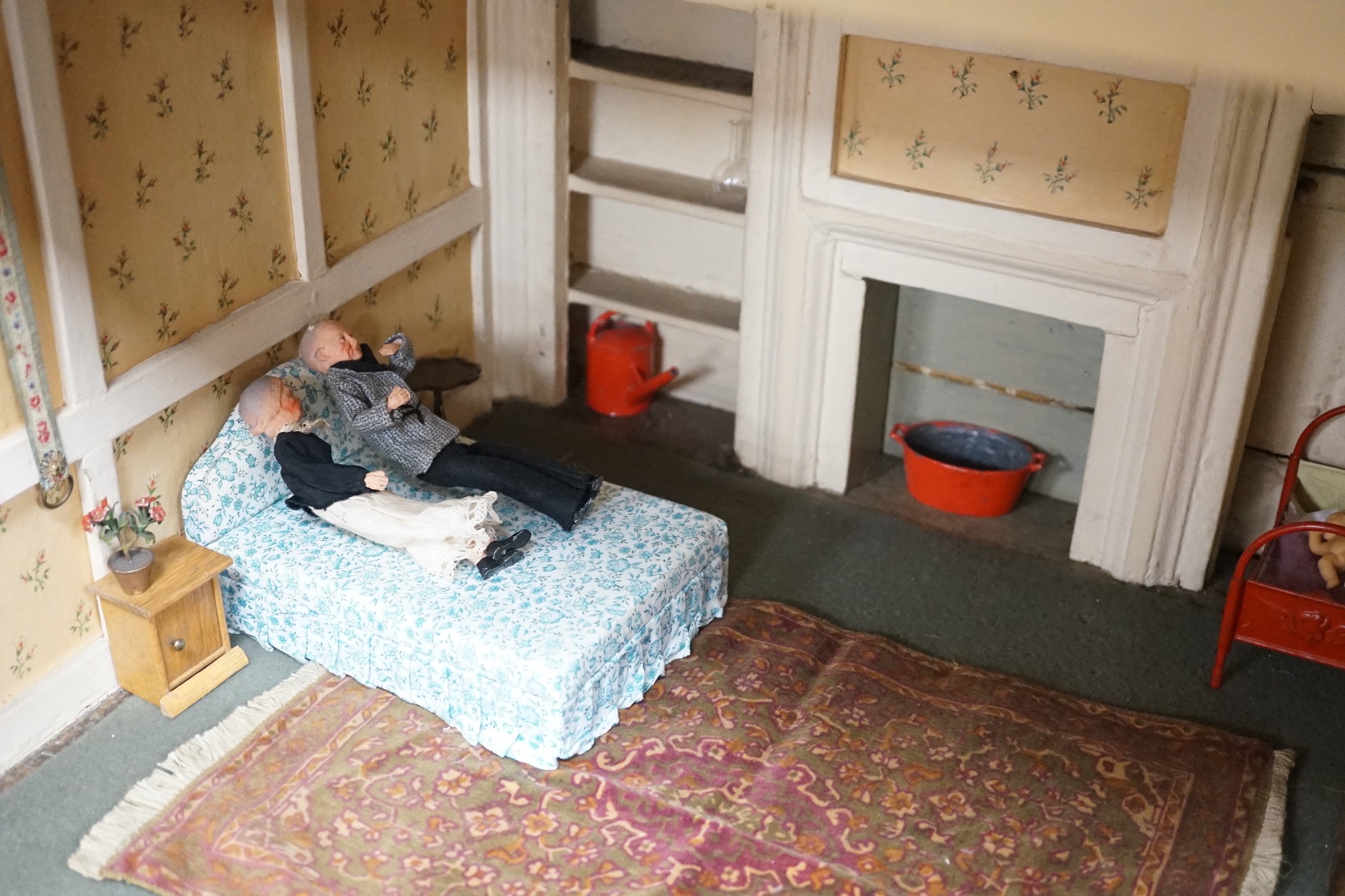 An early 19th century painted doll's house with block work facade enclosing a four room interior with central staircase, to be sold with assorted later furniture and accessories, width 117cm, depth 48cm, height with asso